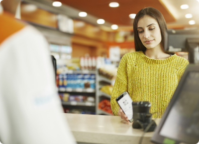 A woman paying at the till