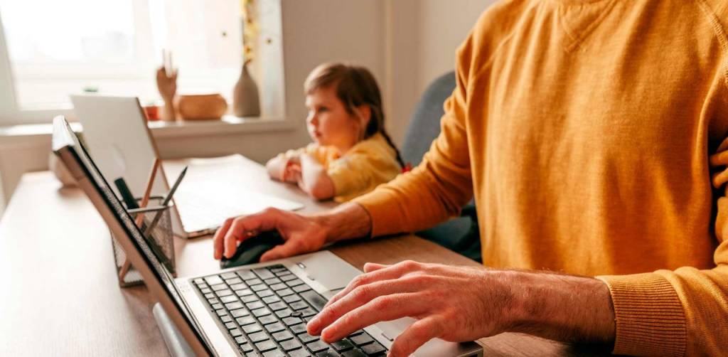 A man and a girl using a computer