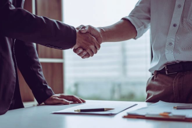 Two people shaking hands